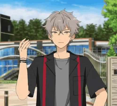 a boy with gray hair is wearing a black shirt with a red stripe