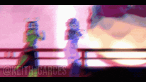 a blurry image of a person with the name keith carces on the bottom