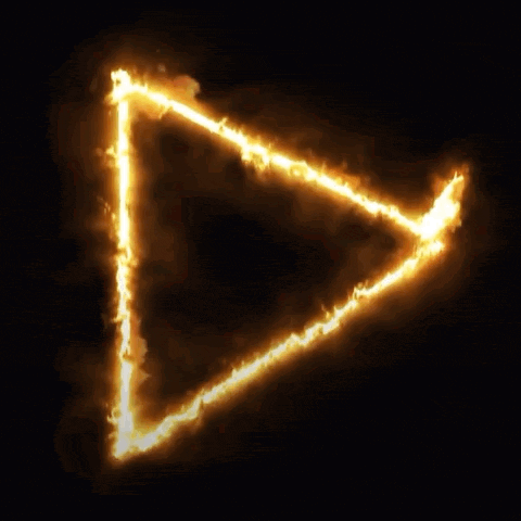 a triangle that is on fire with a dark background