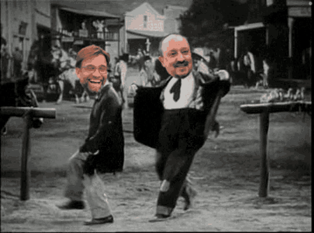 a black and white photo of two men with their faces on it