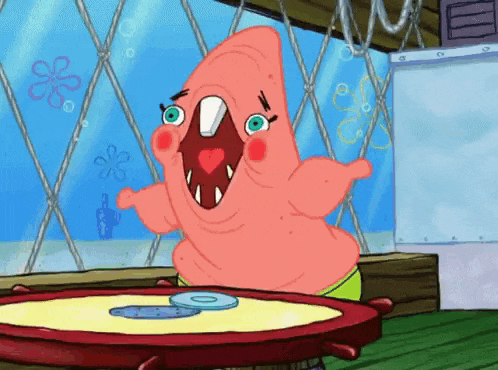 patrick star from spongebob squarepants is sitting at a table with a cd on it