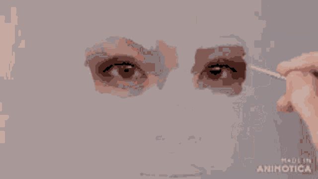 a close up of a person 's face with the words made in animotica on the bottom right