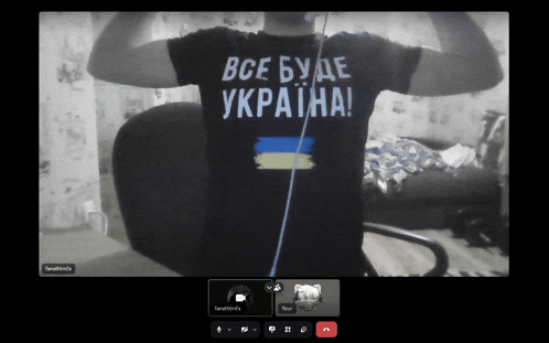 a man in a black shirt that says " все буде украйна "