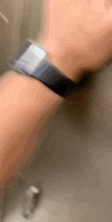 a blurry picture of a person 's wrist with a watch on it