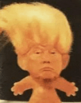 a doll with donald trump 's face and a wig on it .