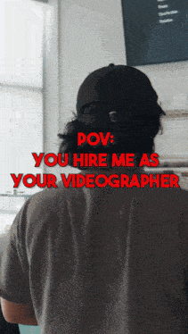 a man wearing a hat is standing in front of a sign that says " pov "