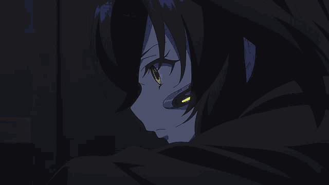 a close up of a person 's face with a blue headset with a yellow light on it