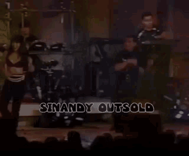 a group of people playing instruments on a stage
