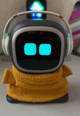 a robot wearing headphones and a yellow scarf on its head