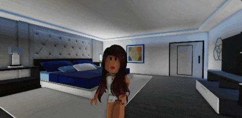 a girl standing in a bedroom with a large bed