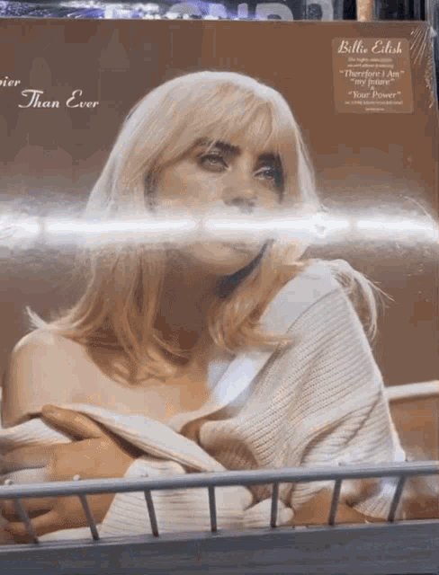 a billie eilish album is sitting on a shelf in a store