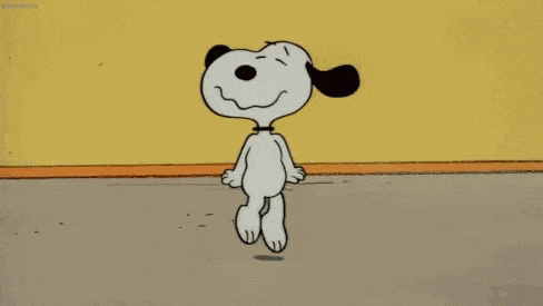 snoopy is dancing in a room with a yellow wall .