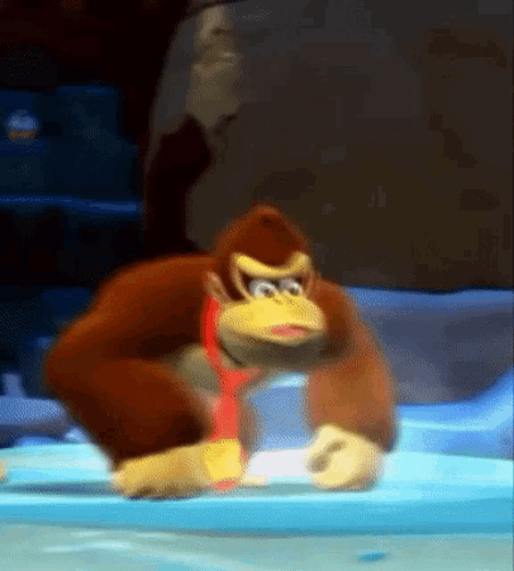 donkey kong is standing on a table in a video game .