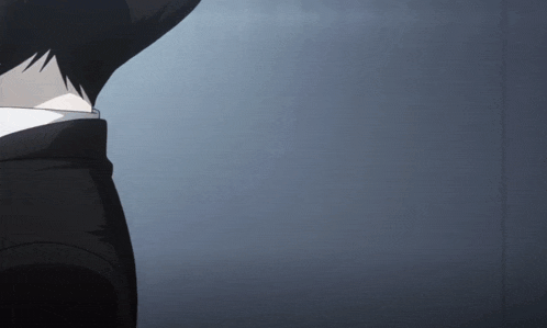 a close up of a person 's back with a gray background