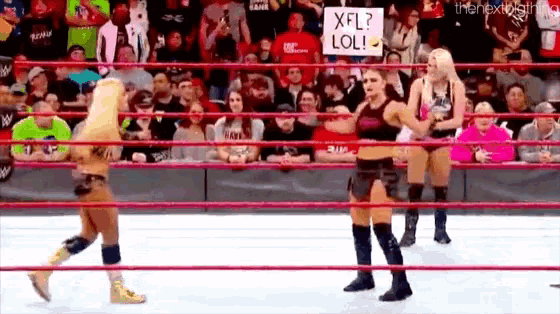 a group of women wrestling in a ring with a sign that says xfl lol .
