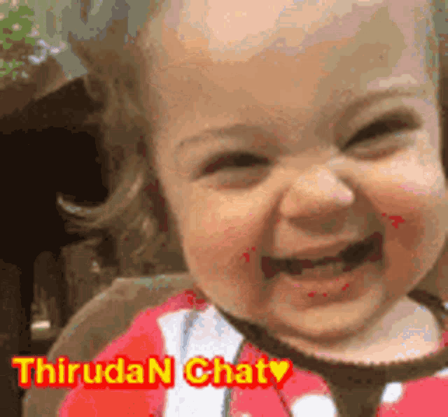 a baby is smiling with the words thiruda n chat on the bottom right
