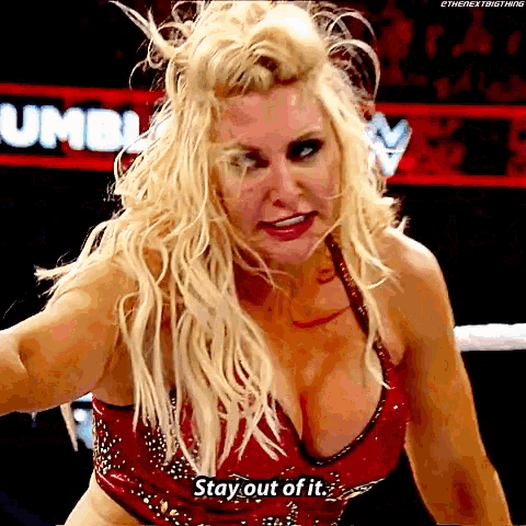 a blonde woman in a red top is saying " stay out of it "