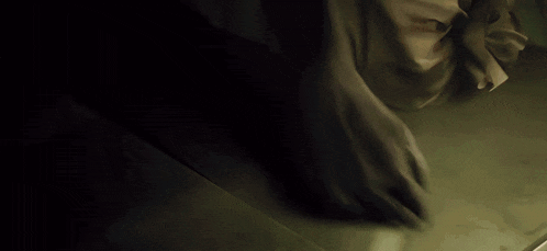 a shadow of a person 's foot is cast on the ground