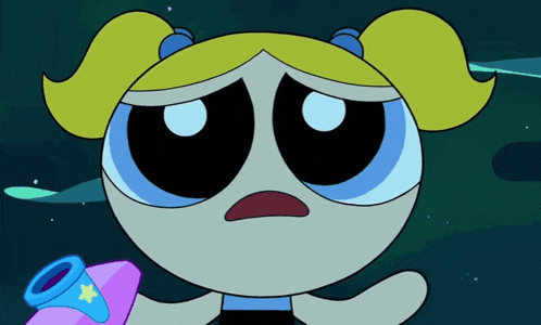 bubbles from the powerpuff girls is sad and holding a pink object