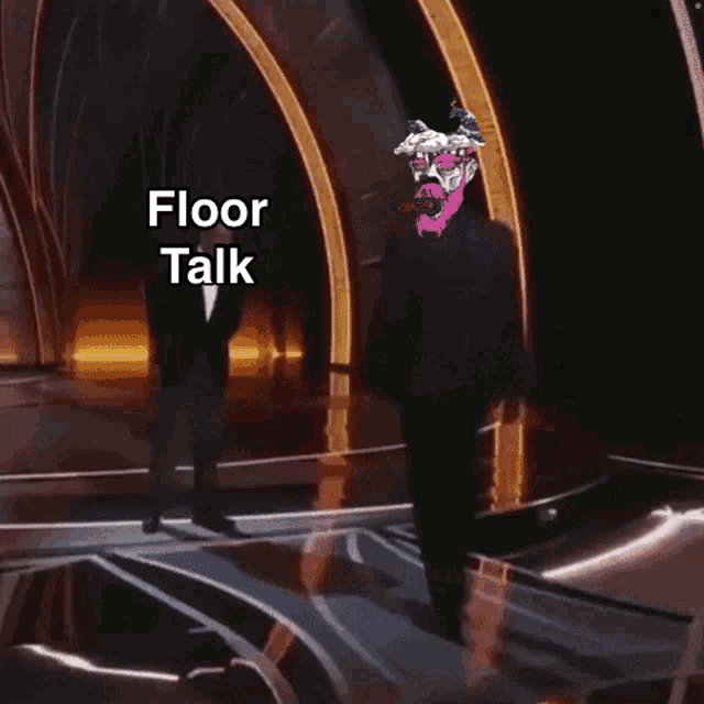 a man in a suit stands on a stage with the words floor talk below him