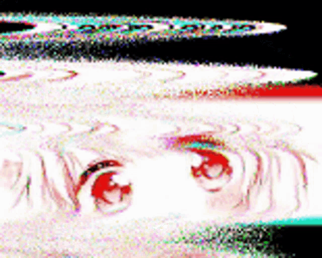 a blurry picture of a person 's face with red eyes