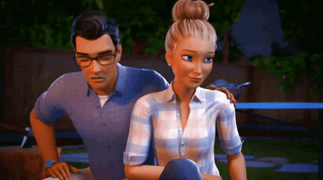 a man and a woman are sitting next to each other and the woman has a bun on her hair