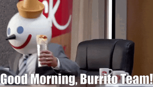 a man in a suit and tie is holding a burrito in front of a jack in the box sign