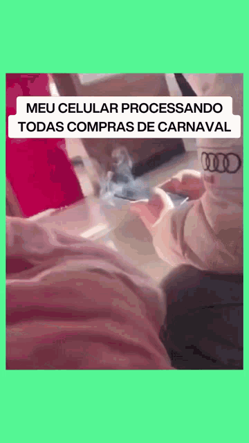 a baby is holding a cell phone with the words meu celular processando todas compras de carnaval written on the bottom
