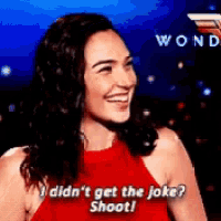 a woman in a red dress says i didn 't get the joke shoot