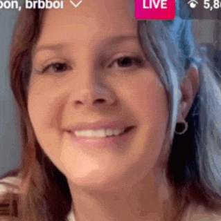 a close up of a woman 's face with a live button above her