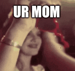 a woman covering her face with her hands and the words ur mom written above her