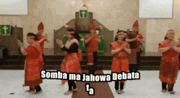 a group of people dancing in a church with the words somba ma jahowa debata ta