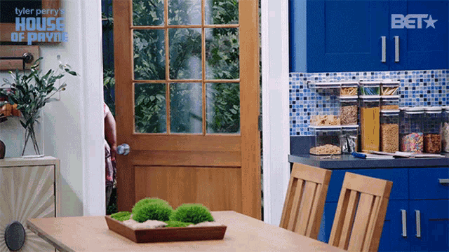 a kitchen with a sign that says house of payne