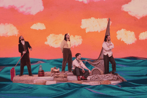 a group of men on a raft in the ocean