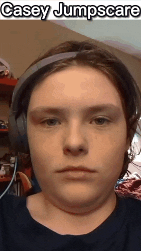 a close up of a person 's face with headphones on and the name casey jumpscare on the bottom