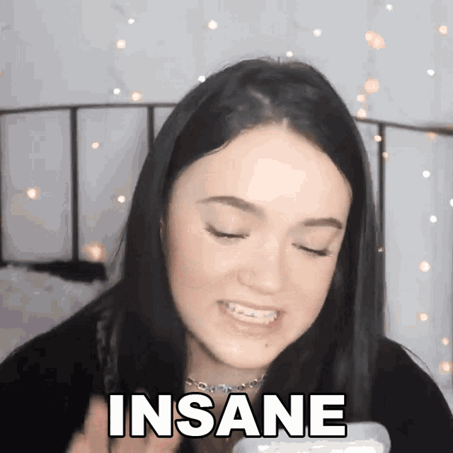 a girl with braces on her teeth is making a funny face and the word insane is on the bottom