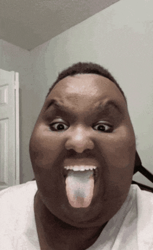 a man making a funny face with his tongue sticking out
