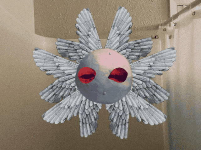 a drawing of a snowflake with wings and red eyes