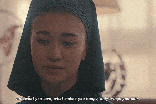 a close up of a woman with the words " and what you love what makes you happy only brings you pain " written below her