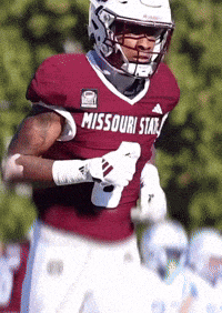 a football player wearing a missouri state jersey and helmet