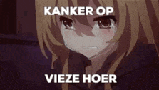 a crying anime girl with the words `` kanker op vieze hoer '' written on the bottom of her face .