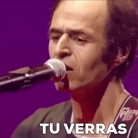 a man is singing into a microphone with the words tu verras written on the bottom