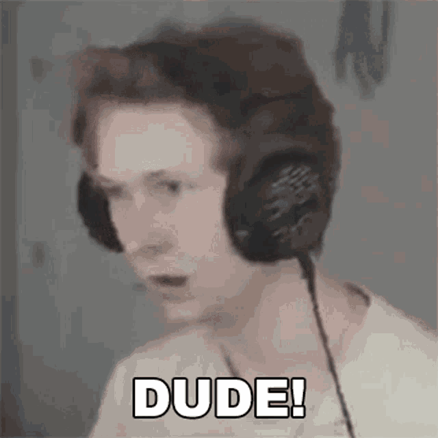a man wearing headphones is making a funny face and saying dude !