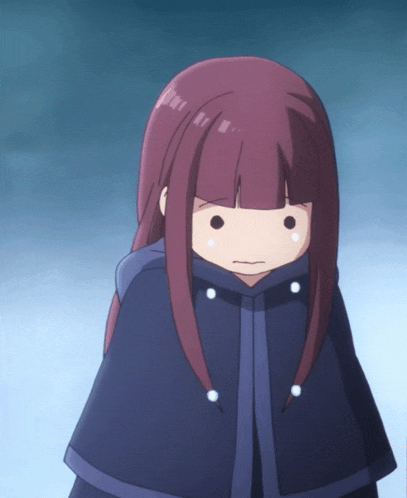 a girl with long red hair is wearing a cape
