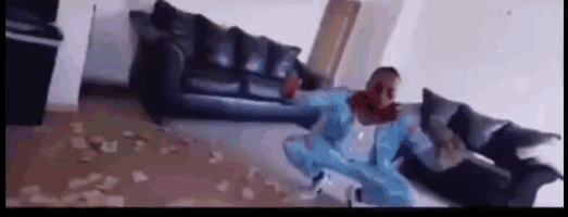 a blurry picture of a person in a living room with a couch .