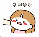 a cartoon girl is blowing a kiss with a heart in her hand .