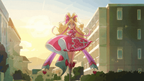 a girl in a pink dress with hearts on her feet