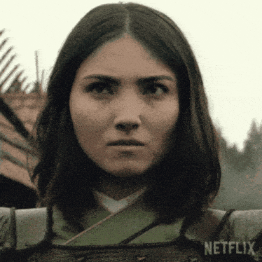 a close up of a woman 's face with netflix written on the bottom right