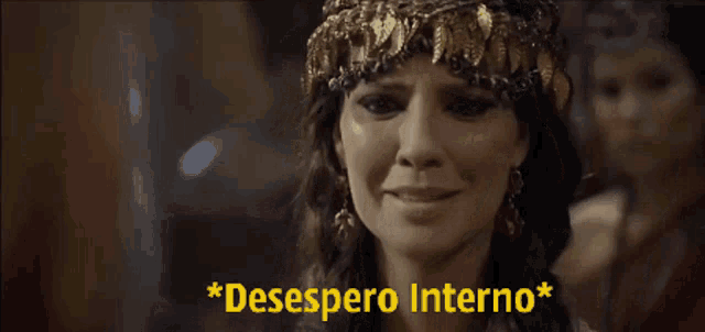 a woman with a crown on her head is smiling with the words * desespero interno * below her