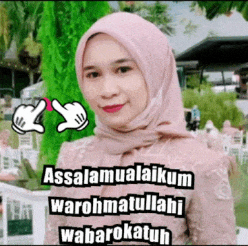 a woman wearing a pink hijab with the words assalamualaikum warohmatullahi wabarokatuh